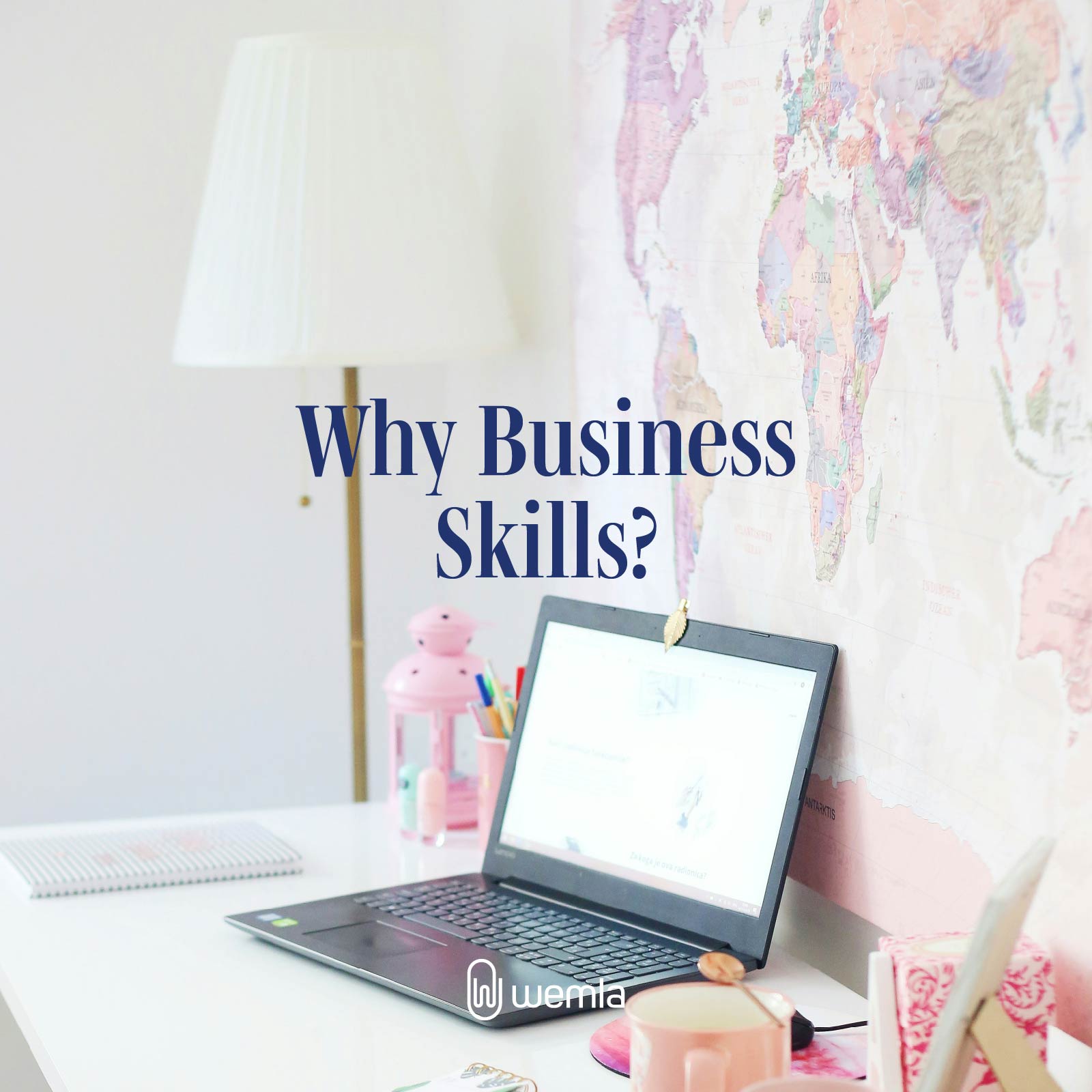Desk with laptop map on wall and text Why business skills?