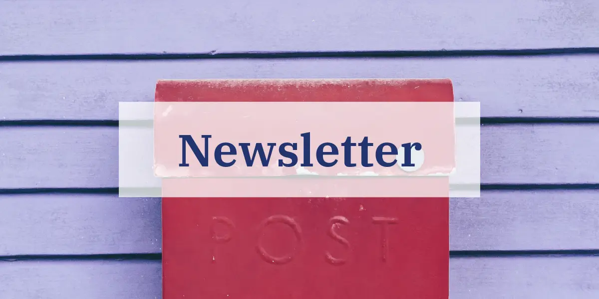 Newsletter, red postbox on violet wooden wall