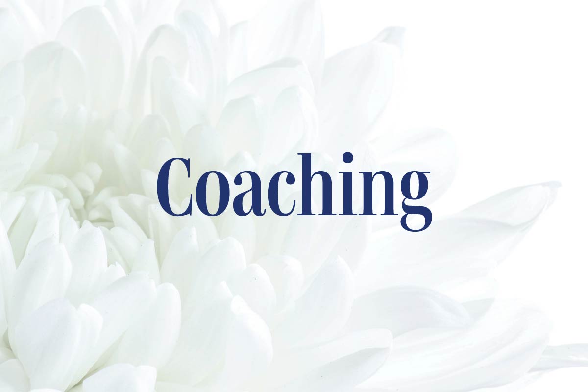 White flower closeup and text Coaching