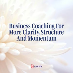 Closeup of white flower and text overlay saying Business Coaching For More Clarity, Structure And Momentum